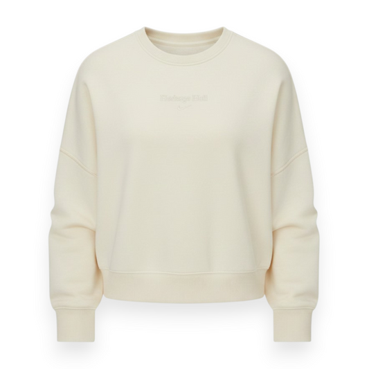 Charger Corner women's cream Nike sweatshirt featuring Heritage Hall branding and a subtle swoop logo design